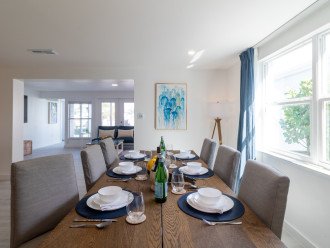 A spacious table & six chairs in a nautical ambiance near the kitchen