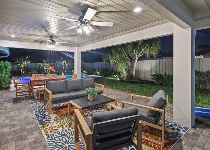 Al fresco elegance: Relax on our outdoor sofa, or gather around the spacious table that seats six on our covered terrace, just steps away from the inviting waters of our pool.