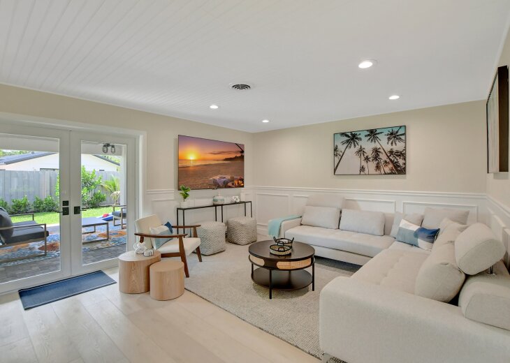 Seamless luxury: Our exquisitely furnished living room opens onto the covered terrace, offering a perfect blend of indoor comfort and outdoor relaxation.