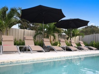 Lounger chairs, umbrellas, and an amazing pool