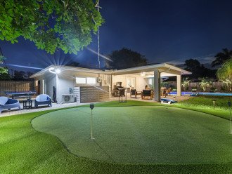 Tee off at our private putting green, with the covered patio and ping pong table nearby, offering endless entertainment possibilities.