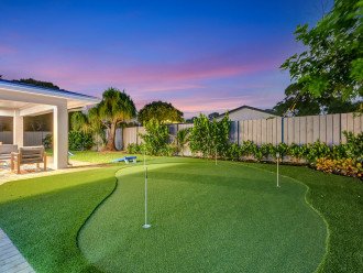 Outdoor fun awaits: Take in the sights of our putting green and corn hole area, nestled alongside the inviting covered terrace, providing endless entertainment options.
