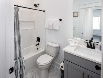 Second level bathroom in Hall with tub/ shower combo