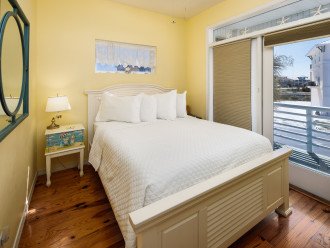 Main level guest room with queen bed