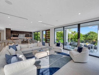Open plan expansive and serene living area with a chef's kitchen, breakfast nook, wet bar boasting Ocean View through floor to ceiling windows.