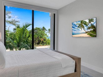 Bedroom Three is located on the second floor, features a king size bed an ensuite bathroom and Ocean views.