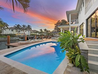 Enjoy canal views from the heated pool, al fresco dinning covered patio and lounge area with a bbq.