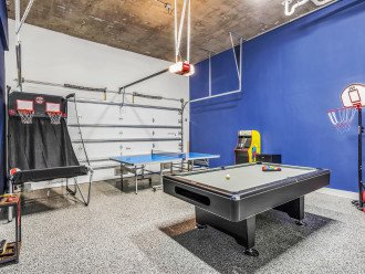 The ultimate game room with a pool table, games and ping pong.