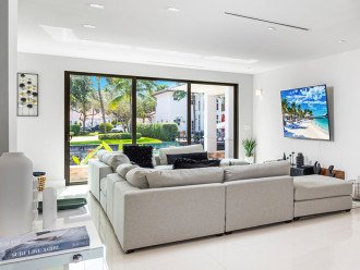 Relish in the waterfront tranquility through floor to ceiling windows of the ample open space living area.