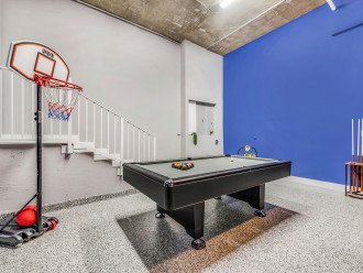 The ultimate game room with a pool table, games and ping pong.