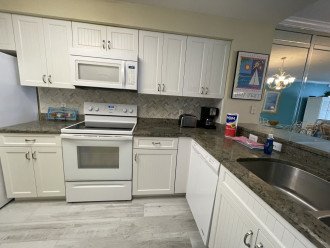 Updated kitchen kitchen features granite countertops.