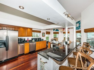 Kitchen with granite and stainless appliances.