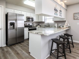Stainless steel appliances in both kitchens