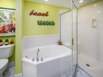 Walk in shower and large bath tub in the guest bathroom