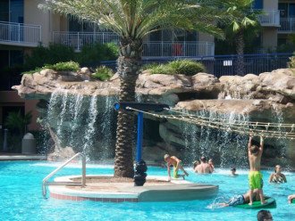 Pool-rope climb with waterfall in background