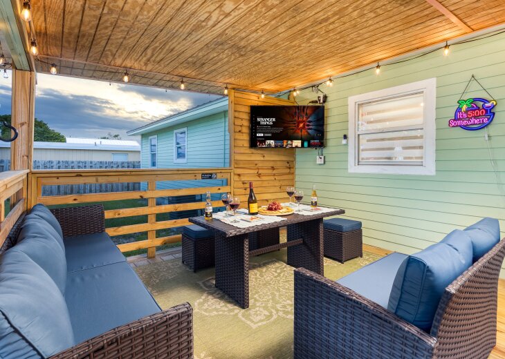 Sink into the covered patio sectional and let the evening wind down. Put the mounted TV on, pour a drink at the bistro table, and stay until the string lights glow.