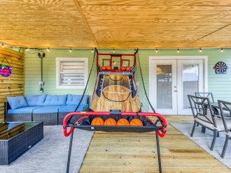 Basketball game and dart board provides outdoor entertainment
