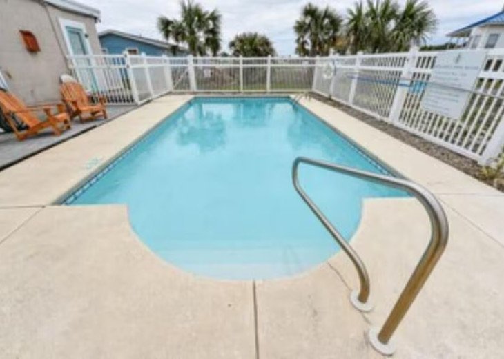 TROUT Steps to beach. Lovely two bedroom with screened porch and pool. #1
