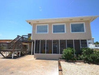 TROUT Steps to beach. Lovely two bedroom with screened porch and pool. #5