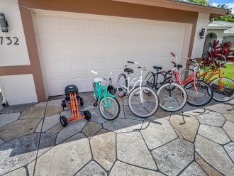 4 adults beach cruiser bicylces, 2 kids bikes, and 1 peddlecart