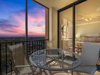 The second screened in lanai is accessed from either of the two guest bedrooms with a dining table, seating for 4, and a lounger.