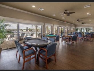 Club house card tables overlooking pool and lake