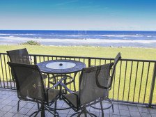 Relax on the private balcony overlooking the ocean, located in the no -