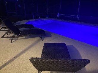 Night swimming, colorful lighted pool