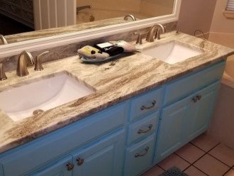 Master bath suite with double sinks and granite counters.