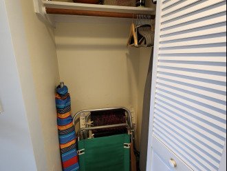Closet with Beach toys, chairs and umbrellas. Tennis and basketball included