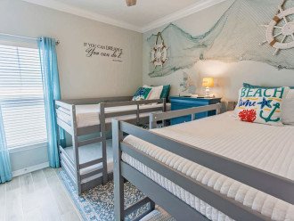 Four twin memory foam bunk-beds, smart TV, nautical inspired third bedroom.