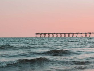 Explore nearby Pensacola pier and enjoy the beautiful pink skies