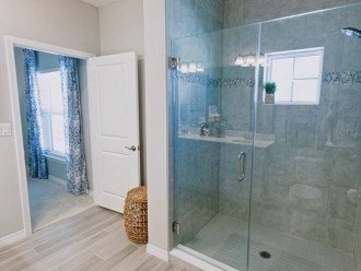 Luxury awaits with a walk-in master shower