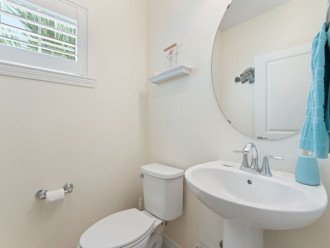 The toilet and bathroom is clean and neatly organized. It is perfect for guest use