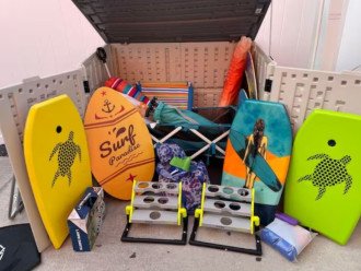 Beach and pool gear. Wagon, chairs, umbrellas, boogie boards, games.