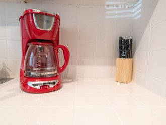 Kitchen includes knife block, regular drip coffee maker and Keurig machine