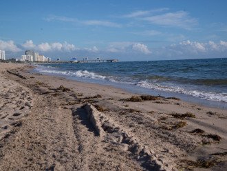 View of the beach located 1 block east of Paradise Shores looking north towards the Pompano Beach Pier.