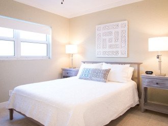 Bedroom includes a comfortable Casper memory foam queen size bed wrapped in quality linens and adorned with plush pillows.
