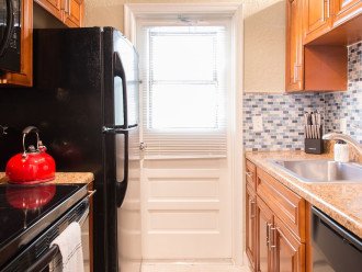 Kitchen includes full size appliances and fully stocked cabinets with everything needed to make a fabulous meal.
