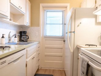 Galley kitchen includes full size fridge, oven, dishwasher, & microwave