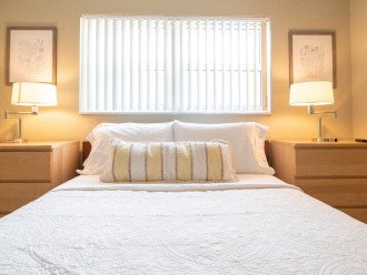 The bedroom includes a queen size Casper memory foam mattress wrapped in high end linens and adorned with plush pillows.