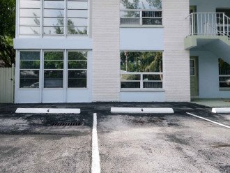 2 dedicated parking spots labeled "4" in front of the Paradise Shores complex. Apt #4 is on the ground floor directly in front of the 2 parking spots. There are no stairs to climb in order to access the front door and no stairs inside the apartment.