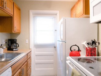 Galley kitchen includes full size major appliances (fridge, stove, dishwasher, microwave)