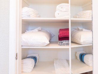 1st Bedroom suite includes a separate linen closet filled with beach towels and plush white bath towels