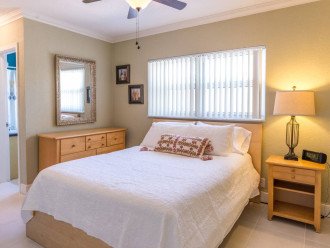 En-suite bedroom #2 includes another queen size bed wrapped in the same plush linens. Other amenities include a ceiling fan and laptop workstation. Connect all of your devices to high speed Xfinity WiFi.