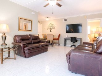Walk through the front door and encounter the open space living room adorned with plush leather furniture, a laptop workstation and separate dining area.