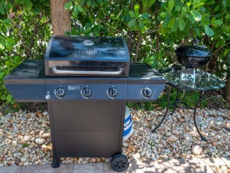 Propane BBQ grill and wood fired BBQ grill located in the east side yard
