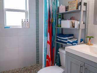 Renovated bathroom, vanity and toilet. Plenty of towels.