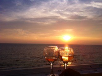Cheers at sunset from the balcony