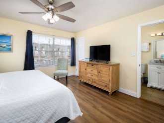 Relax in the master bedroom while watching TV and enjoying the view